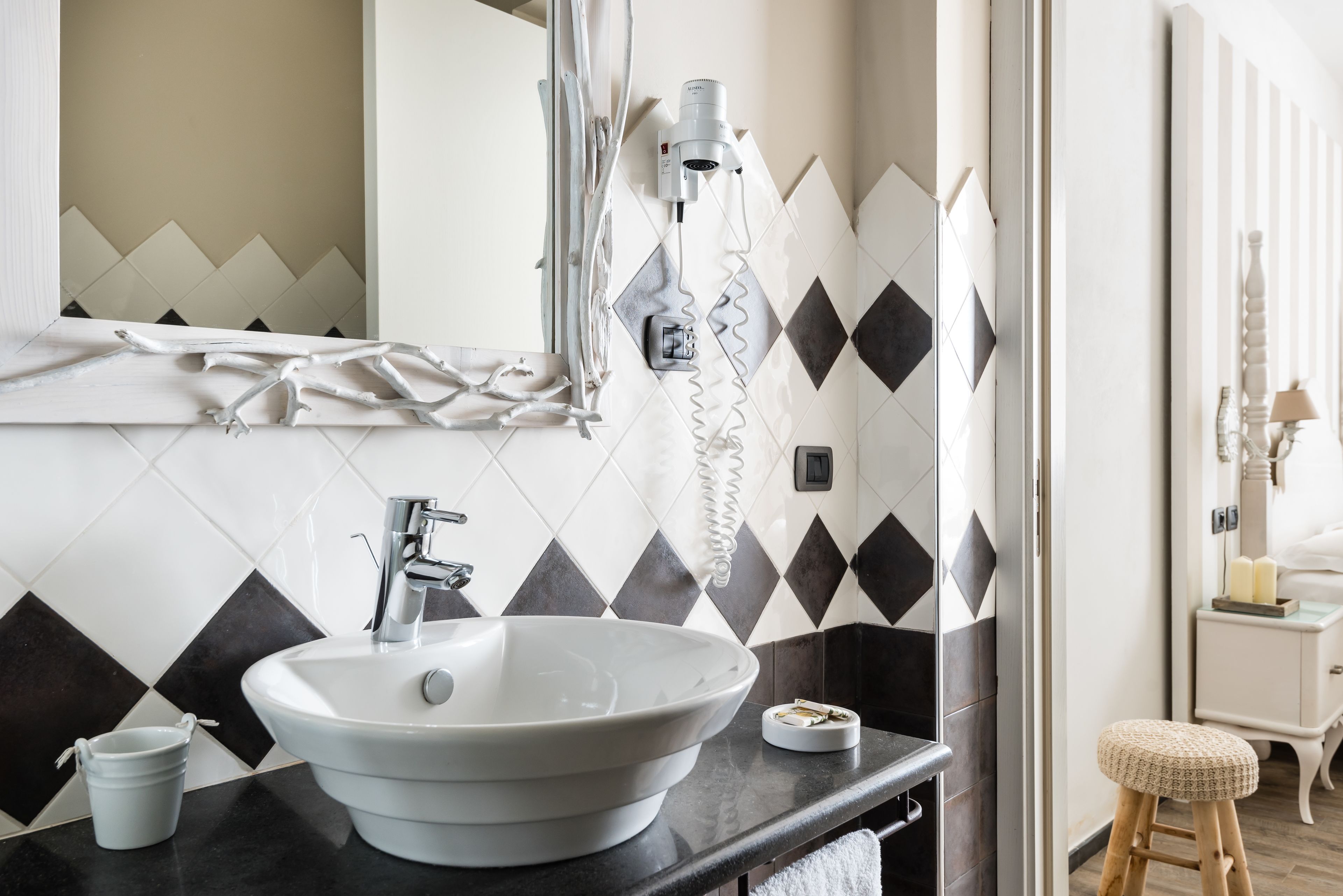 designer toiletries, hair dryer, bidet, towels