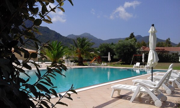 Seasonal outdoor pool, open 4 PM to 8 PM, pool umbrellas, pool loungers