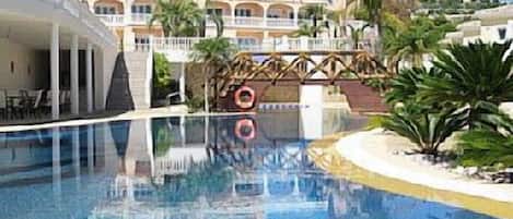 Seasonal outdoor pool, open 9:00 AM to 9:00 PM, pool umbrellas
