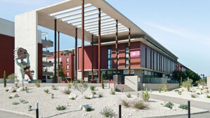 A modern building with a sloped roof and large windows. - Appart'City Classic Nîmes Centre (Nîmes)