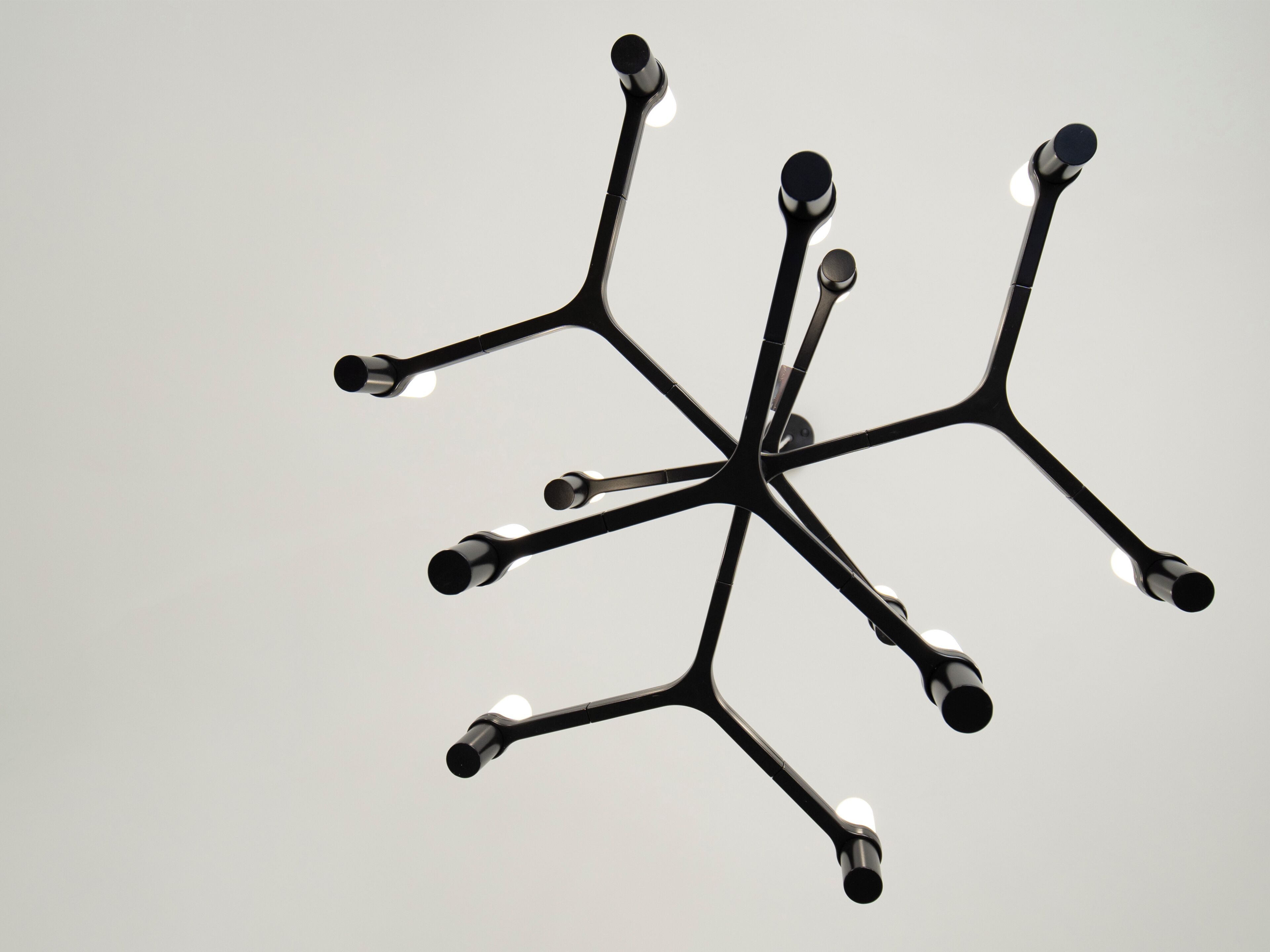 A modern chandelier with multiple arms and bulbs.