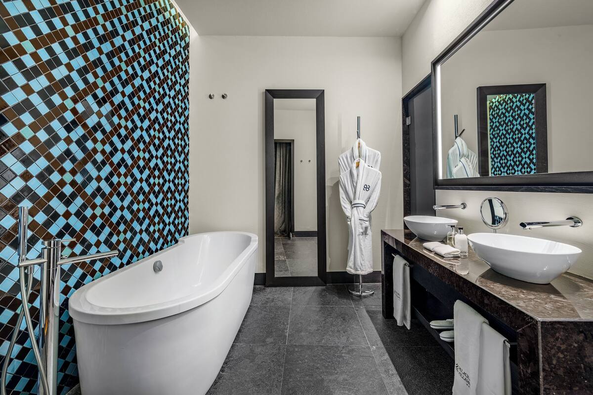 designer toiletries, hair dryer, bathrobes, slippers