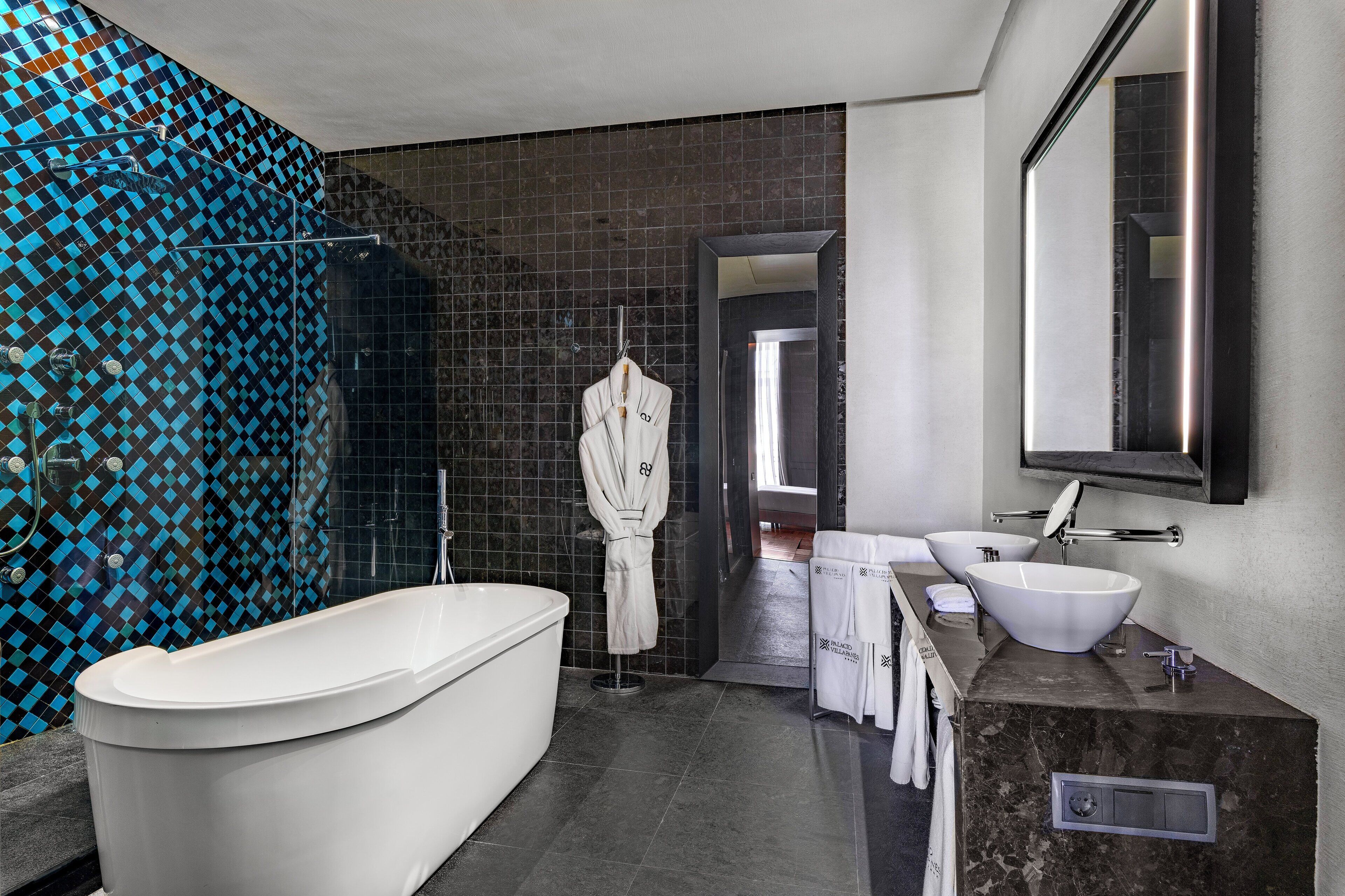 designer toiletries, hair dryer, bathrobes, slippers