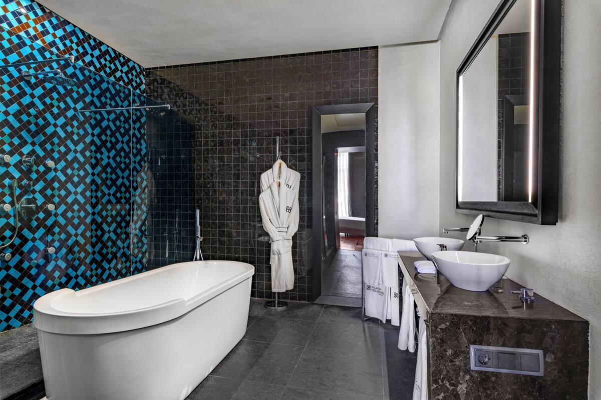 designer toiletries, hair dryer, bathrobes, slippers