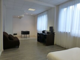 Superior Studio | Individually furnished, desk, blackout drapes, iron/ironing board