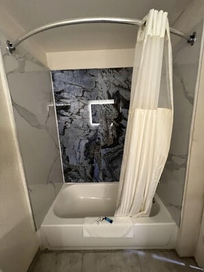 Combined shower/tub, towels - Baymont by Wyndham Texas City (Texas City)