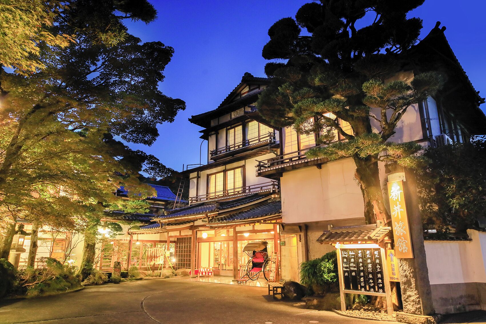 A traditional Japanese building with a wooden exterior and multiple levels.