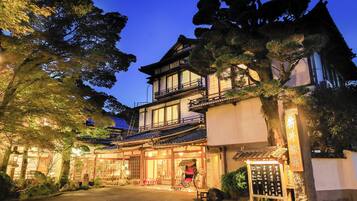 A traditional Japanese building with a wooden exterior and multiple levels.