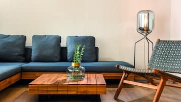 Suite | Living area | 100-cm flat-screen TV with satellite channels, TV, foosball