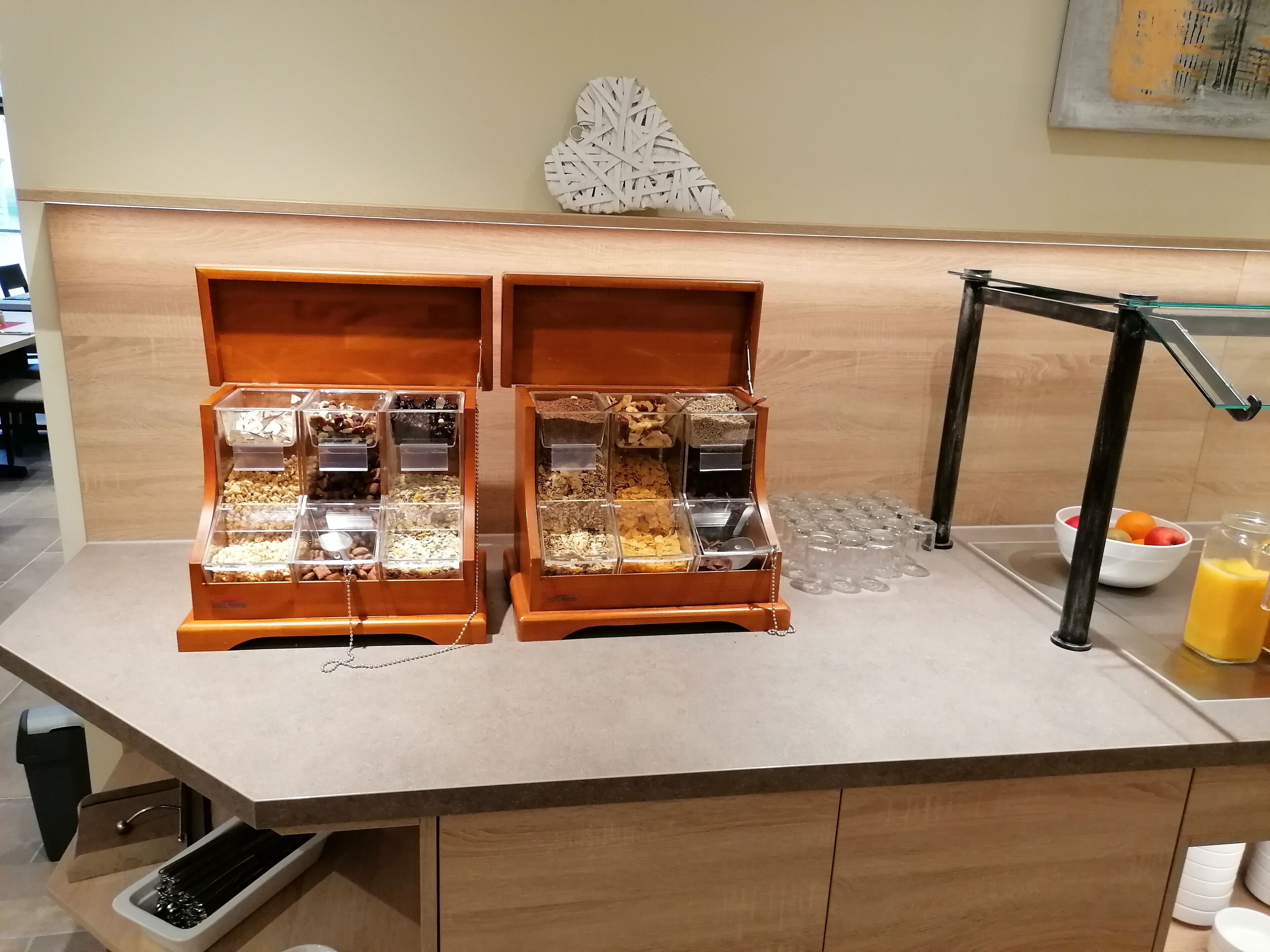 A buffet setup with multiple food dispensers and a drink station.