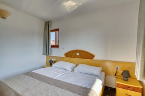 In-room safe, blackout curtains, iron/ironing board, cots/infant beds