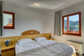 In-room safe, blackout curtains, iron/ironing board, cots/infant beds