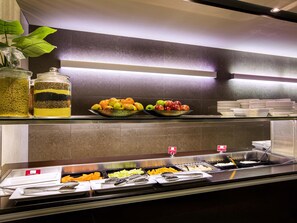 A buffet area with various food items and utensils. - Mercure Sydney Liverpool (Prestons)