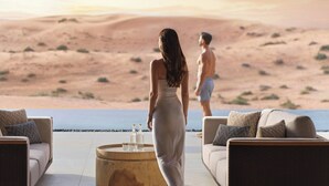 A desert landscape with a pool and outdoor seating area. - The Ritz-Carlton Ras Al Khaimah, Al Wadi Desert (Ras Al Khaimah)