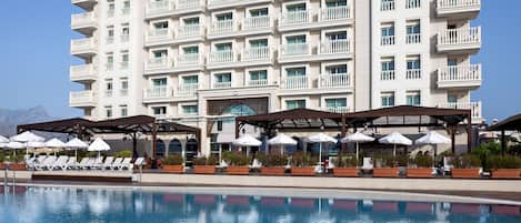 Indoor pool, seasonal outdoor pool, pool umbrellas, pool loungers
