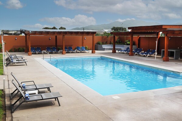 Outdoor pool, open 8:00 AM to 10:00 PM, pool umbrellas, pool loungers