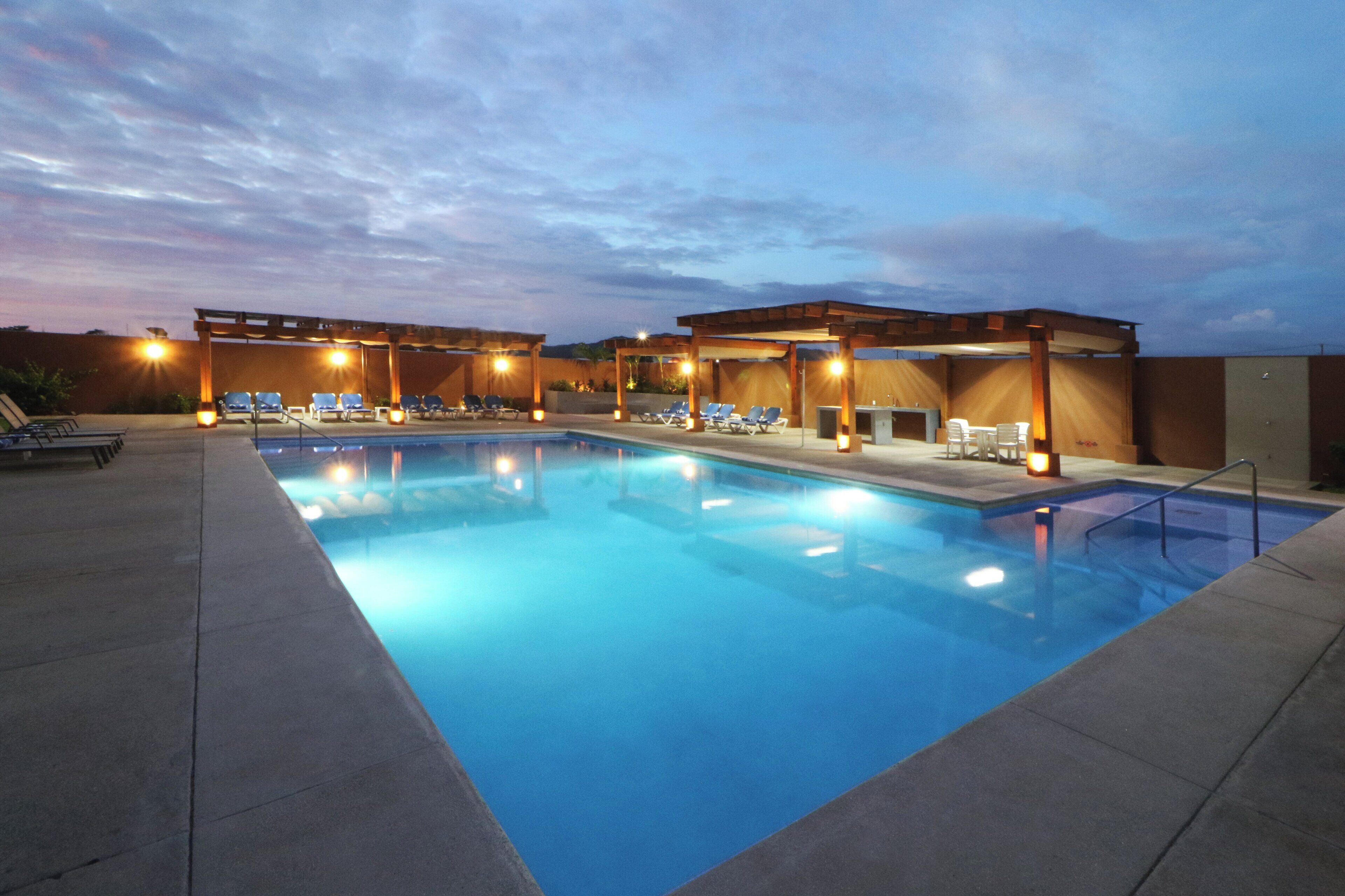 outdoor pool, open 8:00 am to 10:00 pm, pool umbrellas, pool loungers