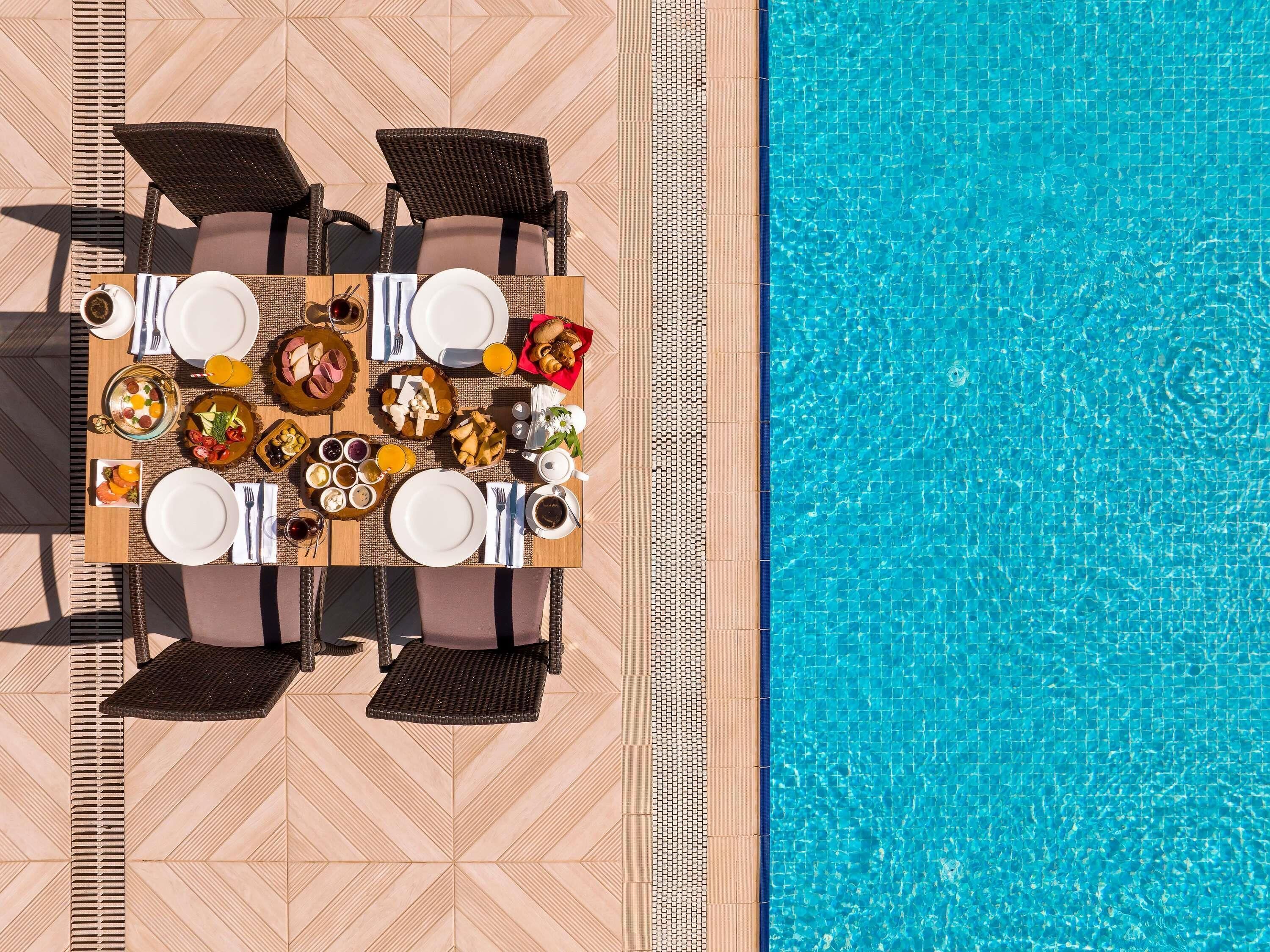 seasonal outdoor pool, open 7:00 am to 7:00 pm, free pool cabanas