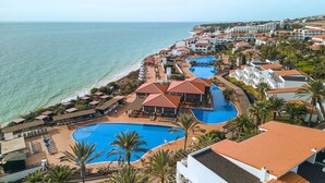 A resort with multiple swimming pools, beach access, and a view of the ocean. - TUI MAGIC LIFE Fuerteventura (Pajara)