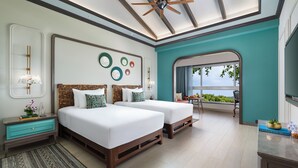 A modern bedroom with two beds, a ceiling fan, and a view of the outdoors. - Fountain, Mahabaleshwar - IHCL SeleQtions (Mahabaleshwar)