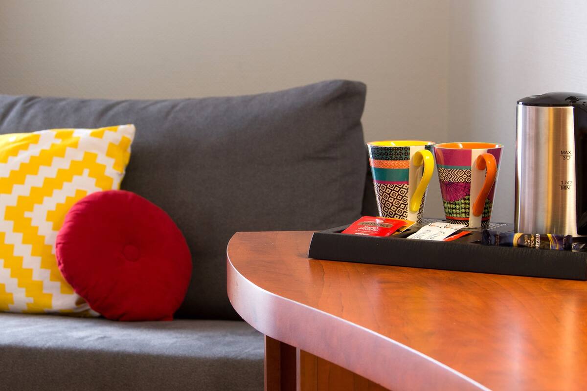 family room | in-room safe, desk, blackout curtains, soundproofing