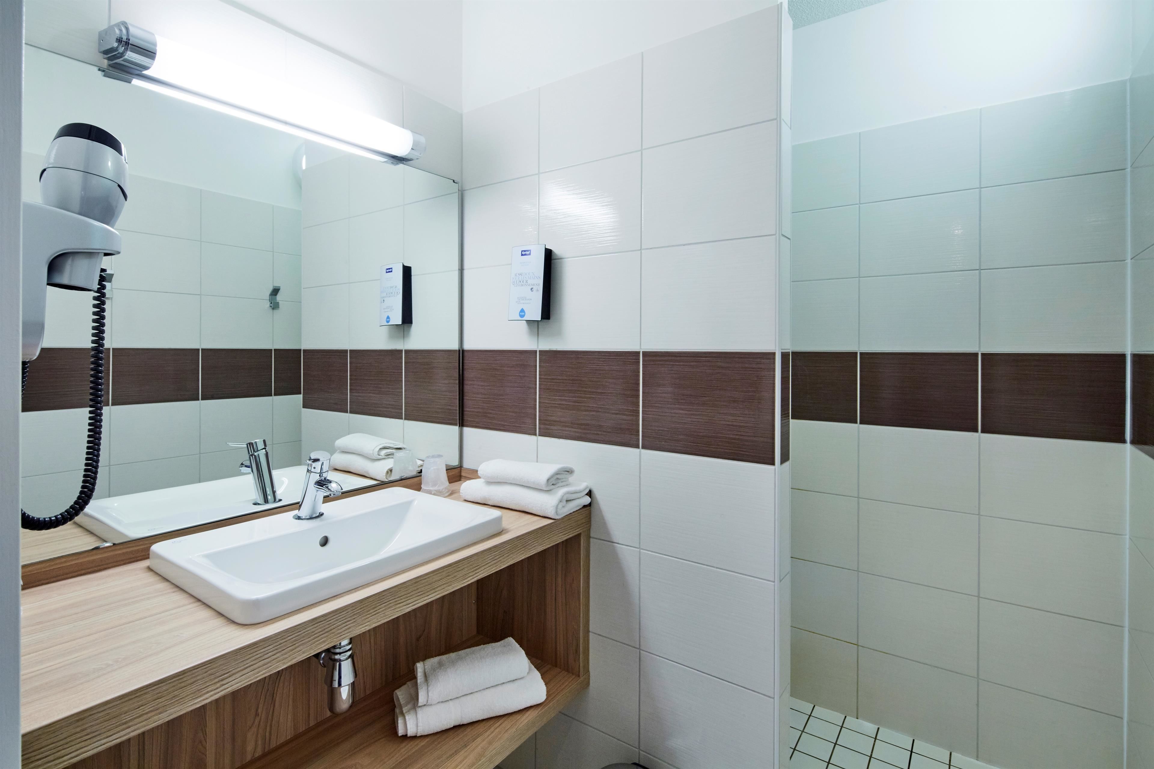 eco-friendly toiletries, hair dryer, towels