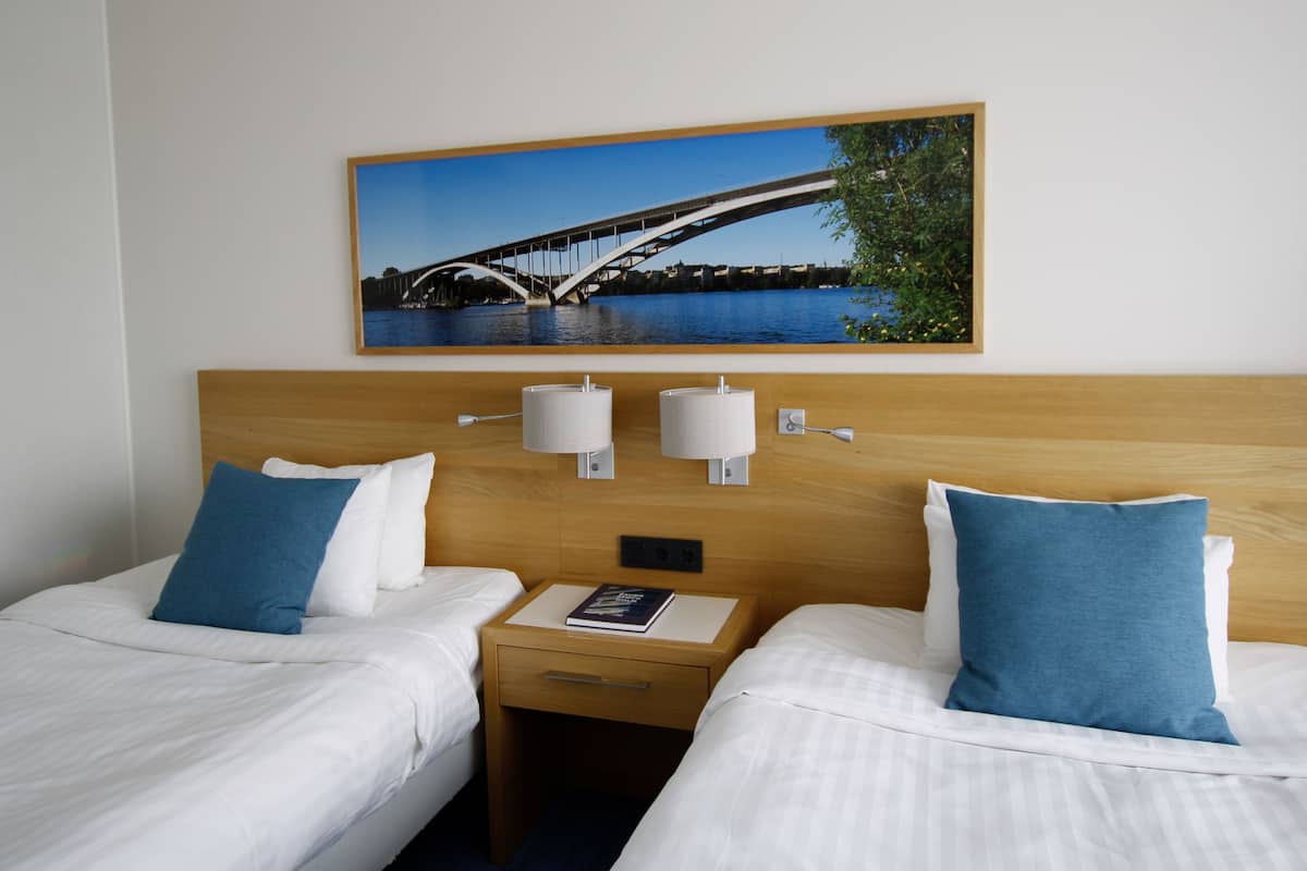 deluxe room, 2 double beds | 1 bedroom, in-room safe, desk, laptop workspace