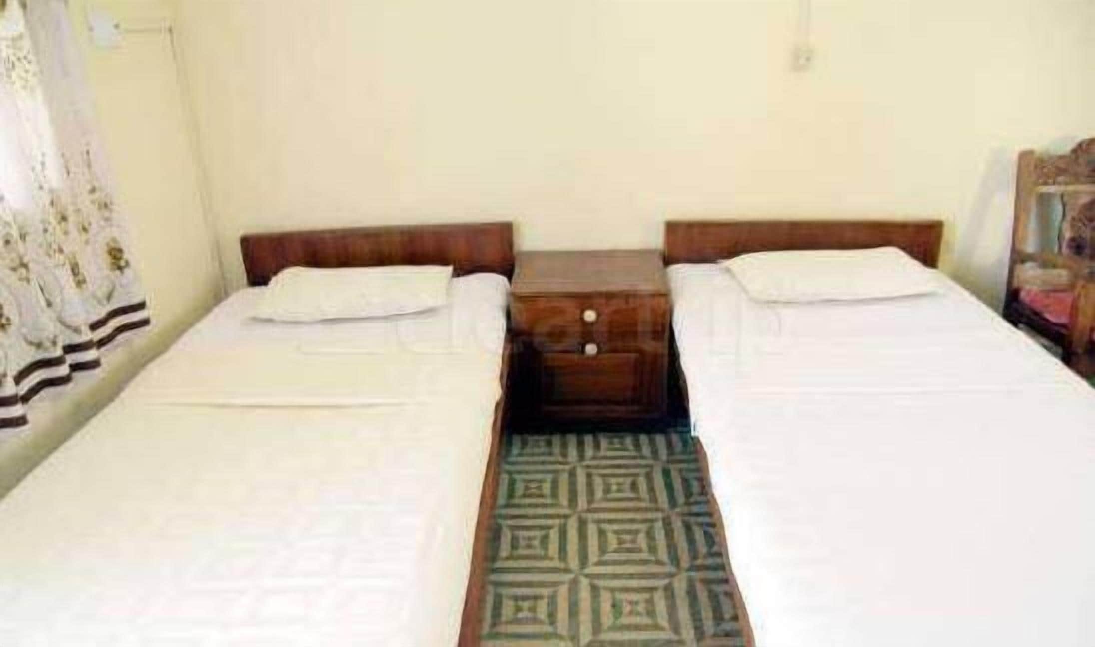 standard room (non ac) | desk, blackout curtains, bed sheets