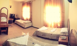 Basic Triple Room, 3 Twin Beds, Private Bathroom | Down comforters, in-room safe, iron/ironing board, free WiFi - Sun Set Hotel (Wadi Musa)