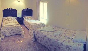 Basic Triple Room, 3 Twin Beds, Private Bathroom | Down comforters, in-room safe, iron/ironing board, free WiFi - Sun Set Hotel (Wadi Musa)
