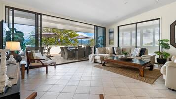 Penthouse | Living area | 32-inch LCD TV with cable channels, TV, DVD player