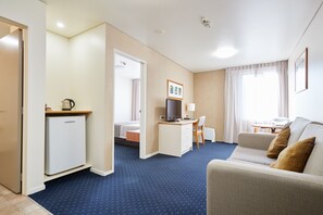 Standard Suite | Living area | 43-inch LCD TV with digital channels, TV, Netflix