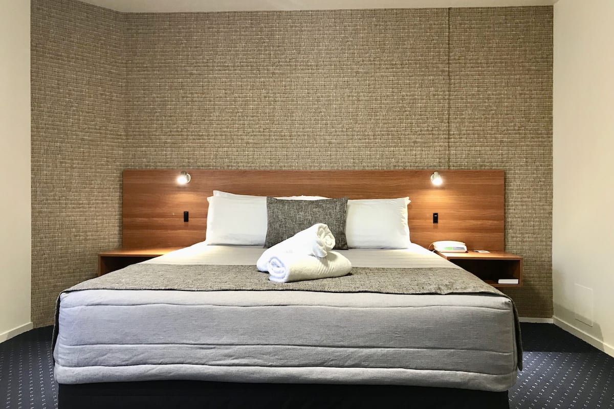 deluxe studio | desk, blackout curtains, soundproofing, iron/ironing board