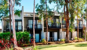A modern multi-story building with balconies, surrounded by trees and landscaped gardens. - Margarets Forest (Margaret River)