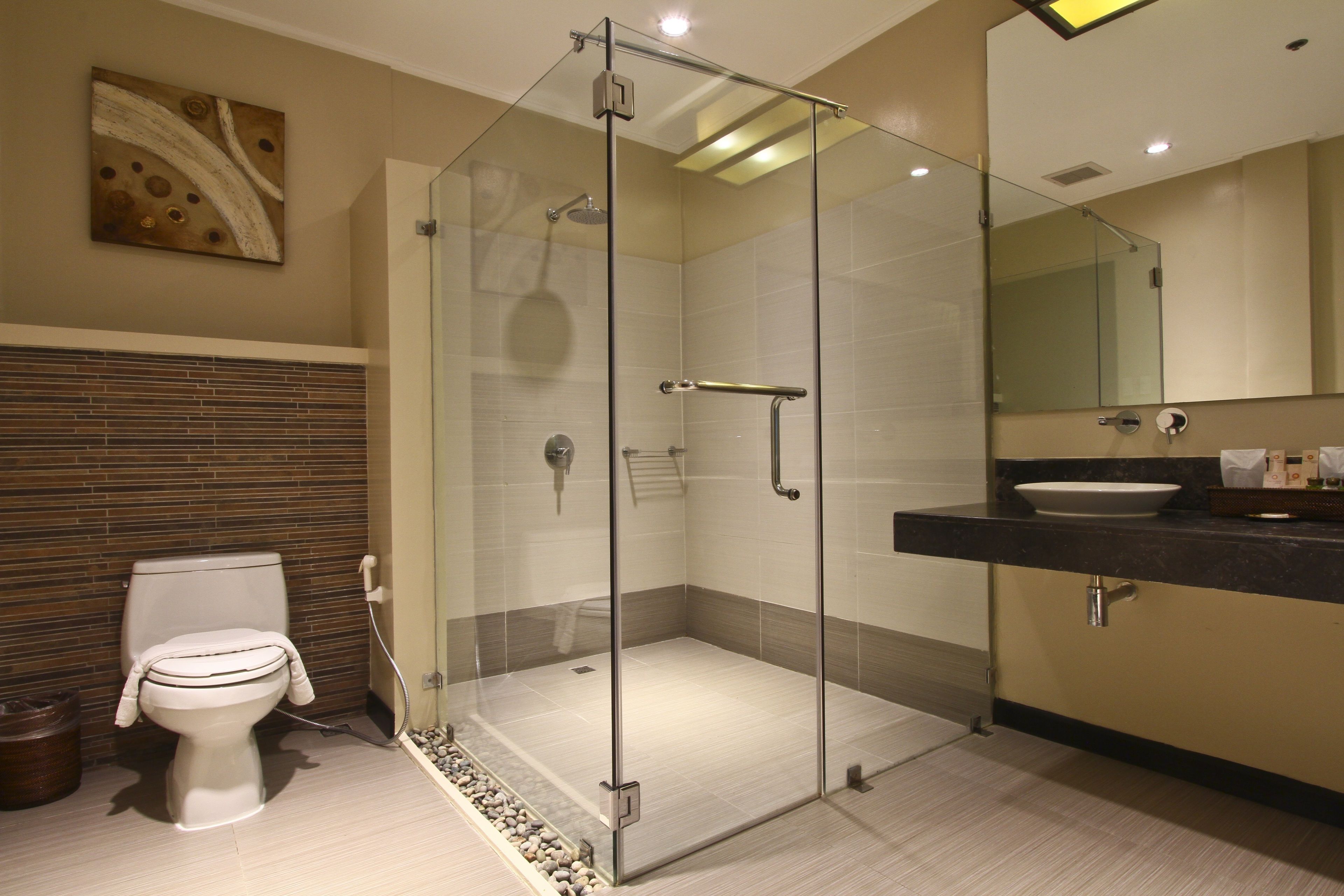 junior studio suite | bathroom | shower, rainfall showerhead, free toiletries, hair dryer