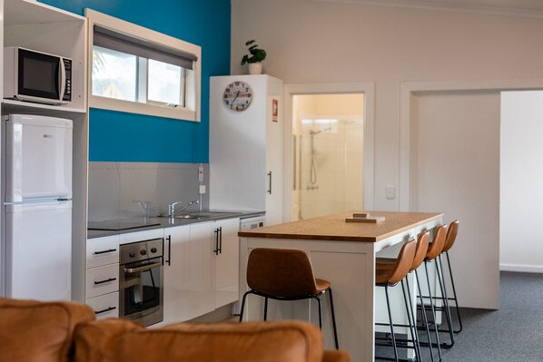 Two Bedroom Family Apartment | Living area | Flat-screen TV, DVD player - Horizon Apartments Narooma (Narooma)