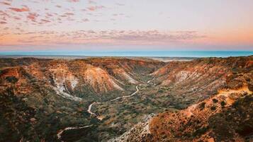 A canyon landscape with a winding road.
