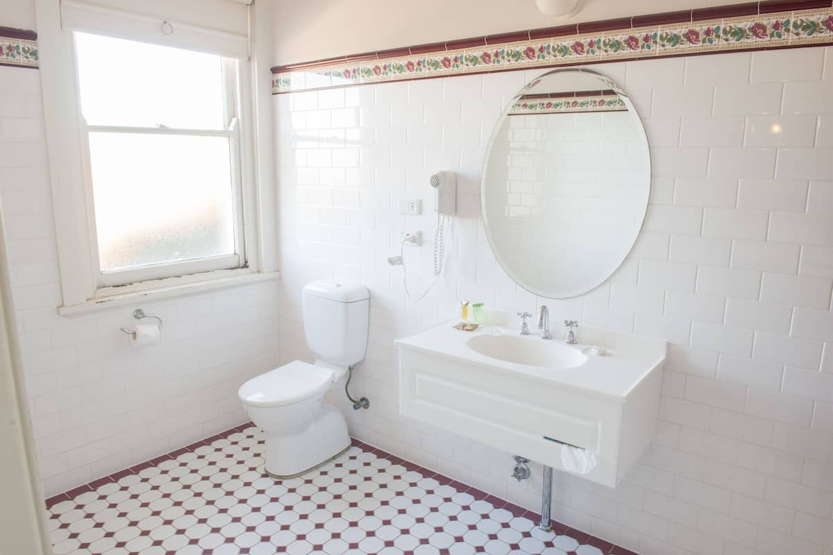 deluxe room, 1 king bed | bathroom | free toiletries, hair dryer, towels