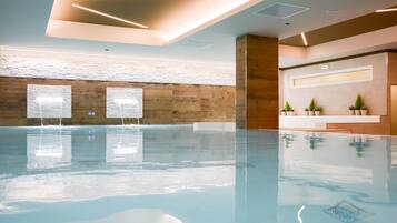 Indoor pool, open 10:00 AM to 10:00 PM, pool loungers