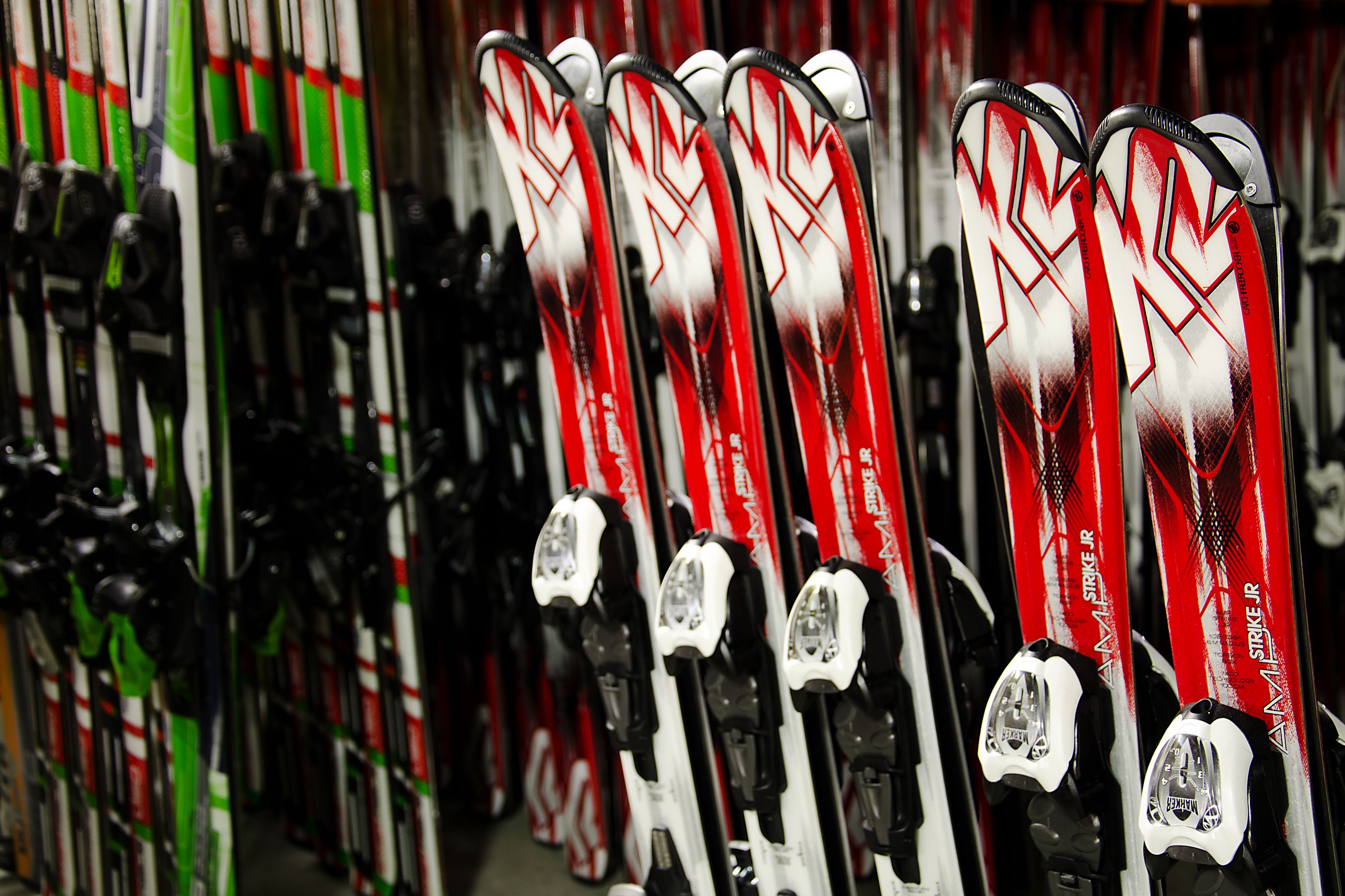 Skis lined up in a store.