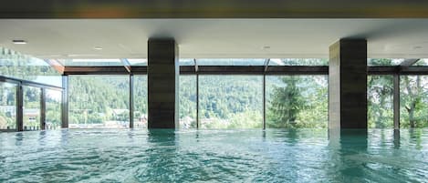 Indoor pool, open 10:00 AM to 10:00 PM, pool loungers