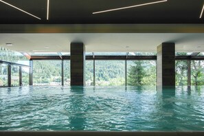 Indoor pool, open 10:00 AM to 10:00 PM, pool loungers