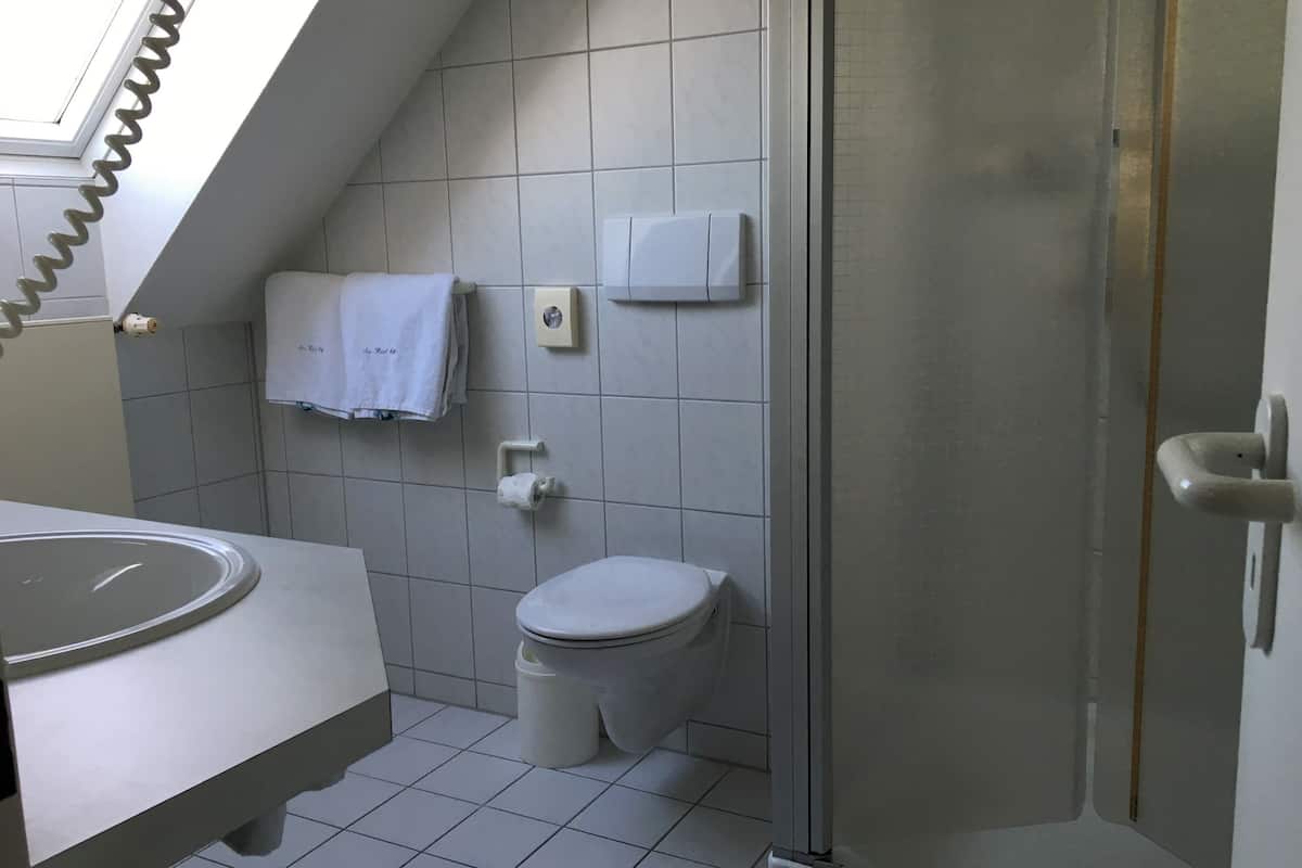 standard double room, balcony, partial lake view | bathroom | shower, rainfall showerhead, hair dryer, slippers