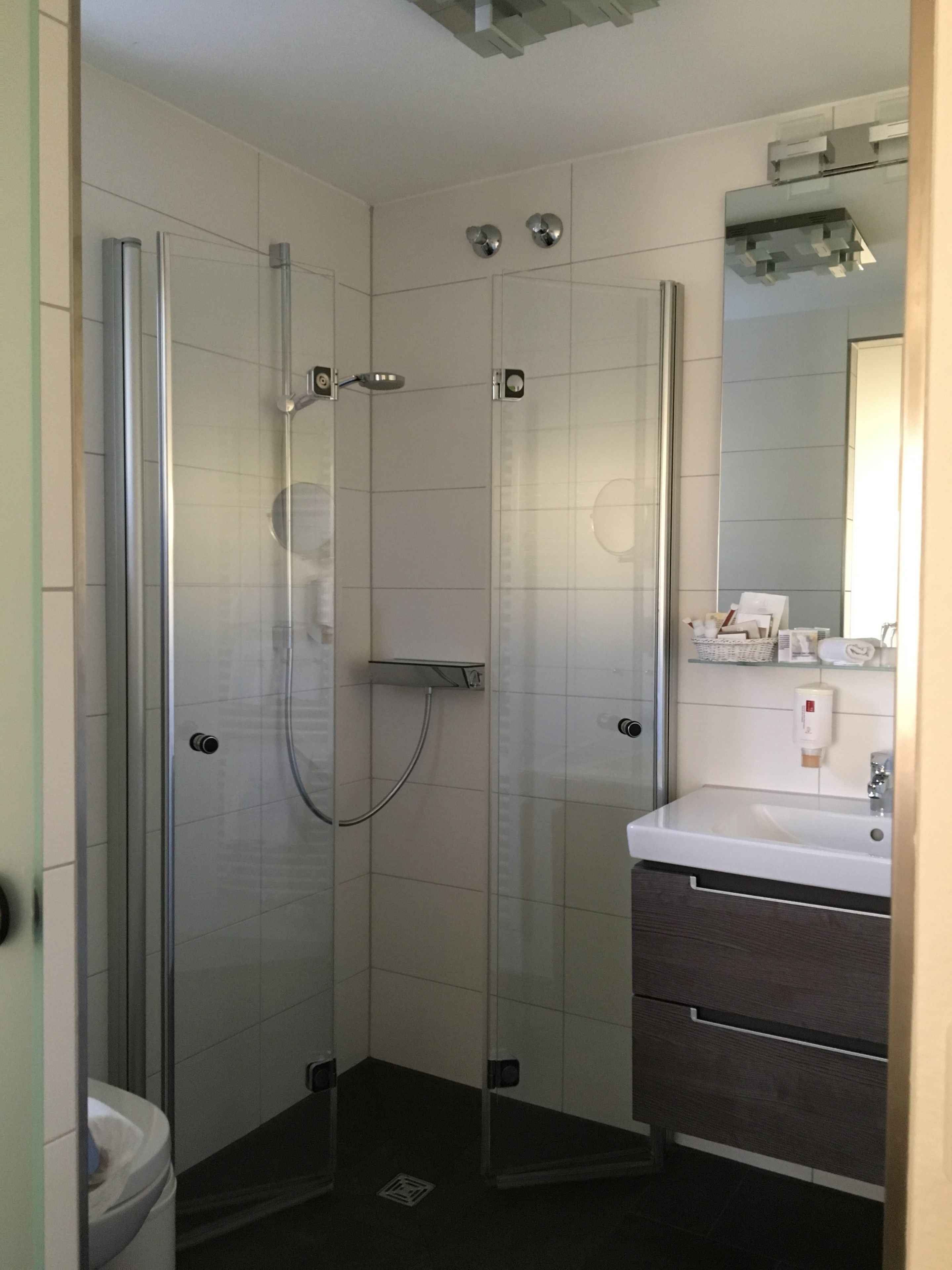 standard double room, balcony, partial lake view | bathroom | shower, rainfall showerhead, hair dryer, slippers