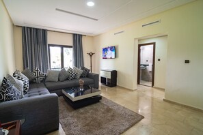 Deluxe Apartment, 2 Bedrooms | Living area | 32-inch flat-screen TV with satellite channels, TV - Diamant Vert (Ain Chkef)