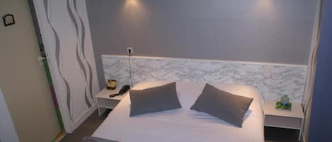 Hypo-allergenic bedding, desk, blackout drapes, soundproofing