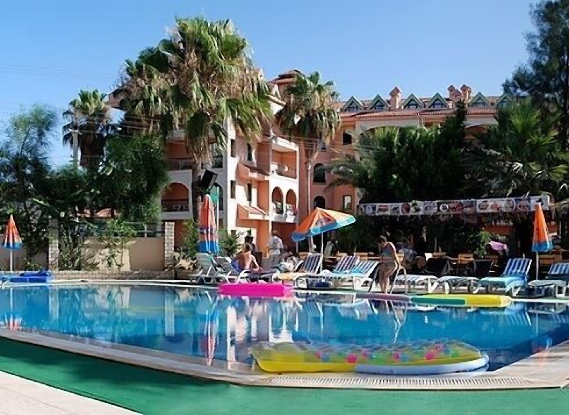 Outdoor pool, open 8 AM to 6 PM, pool umbrellas, sun loungers