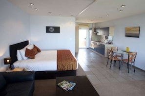 Signature Studio Suite, 1 Queen Bed, Jetted Tub, Sea View | Memory-foam beds, soundproofing, iron/ironing board, free WiFi