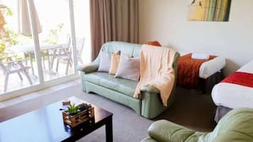 Signature Suite, 1 Bedroom, Jetted Tub, Sea View | Living room | 55-inch Smart TV with satellite channels, TV, Netflix