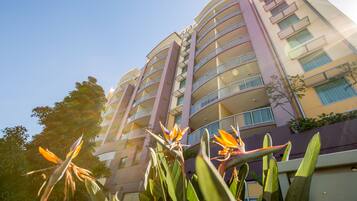Orion hotel offers outdoor space on each floor with balconies overlooking a landscaped area.